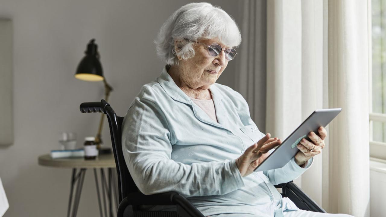 Elderly person using a tablet