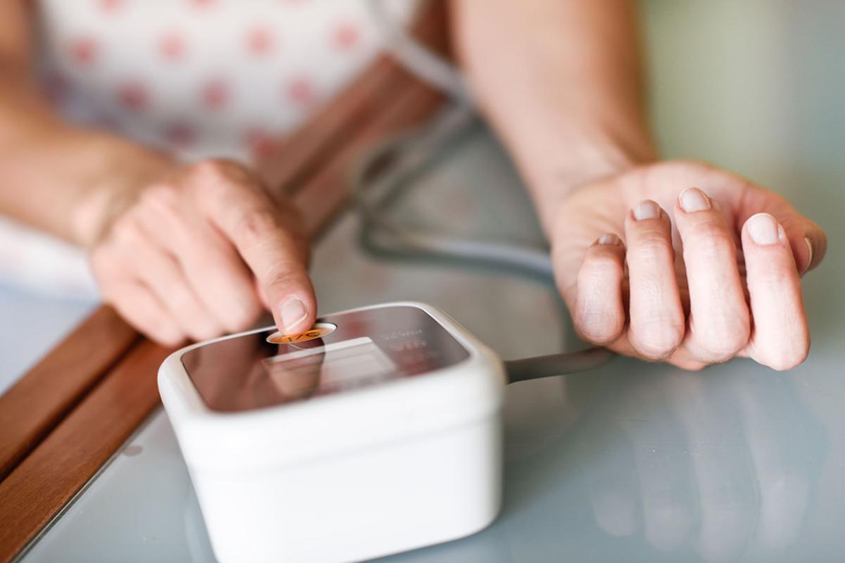 Person measuring blood pressure