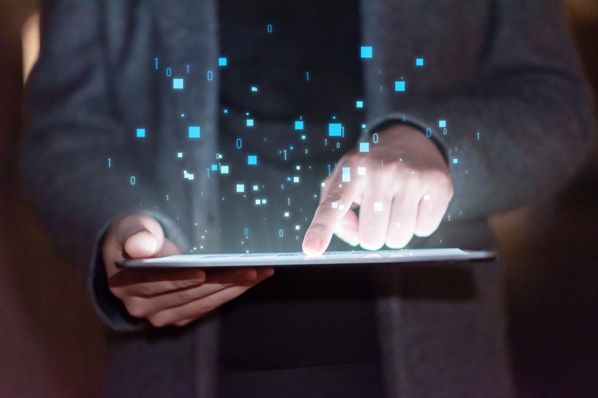 Tablet with icons emerging from the screen
