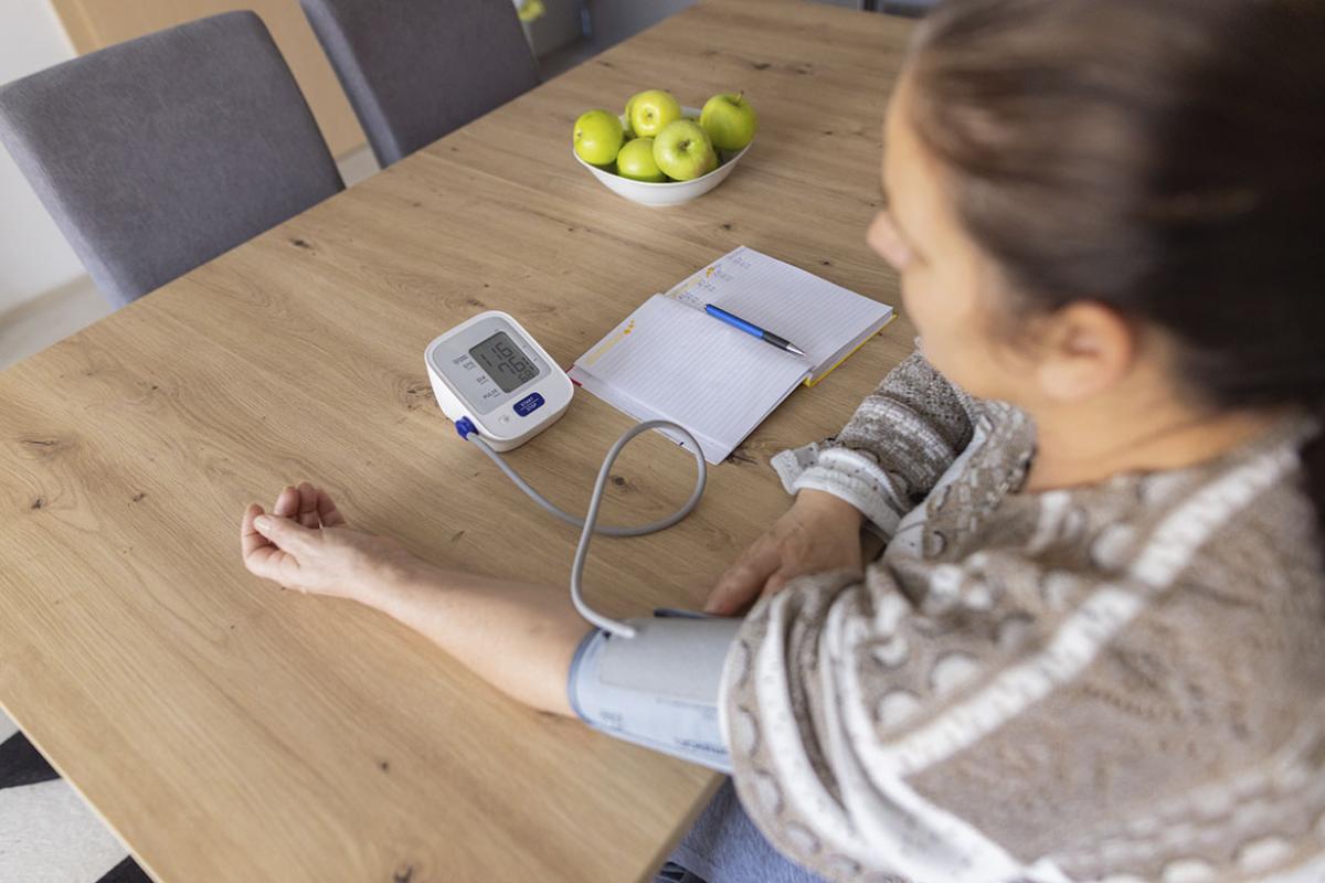 Person checking their blood pressure at home