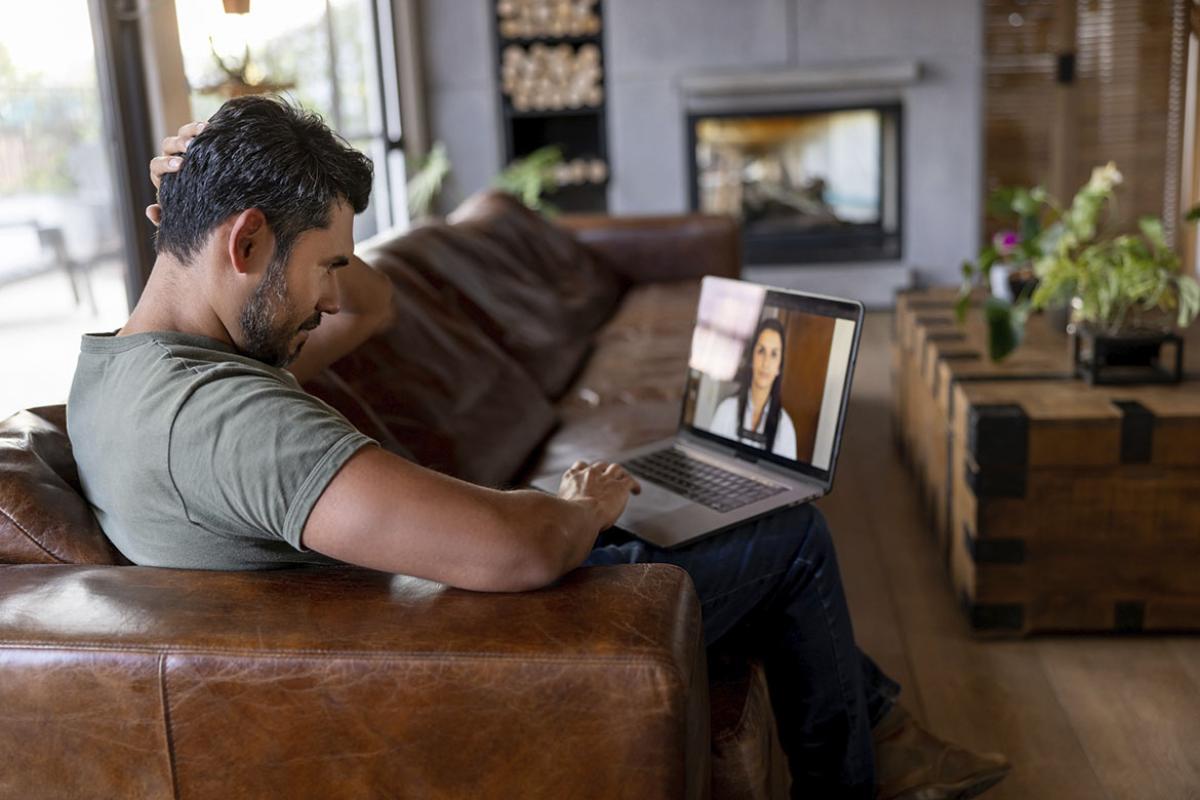 Patient at home having a telehealth appointment with doctor