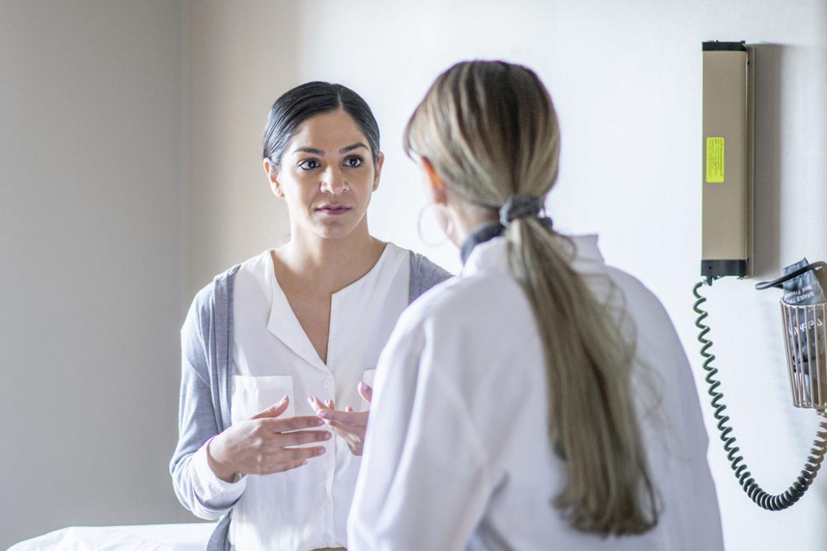 Woman speaks with physician during an appointment