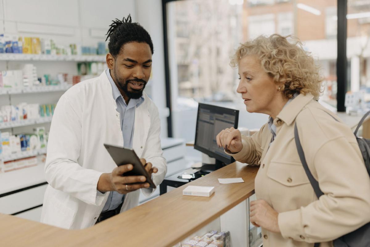Pharmacist consulting with a customer