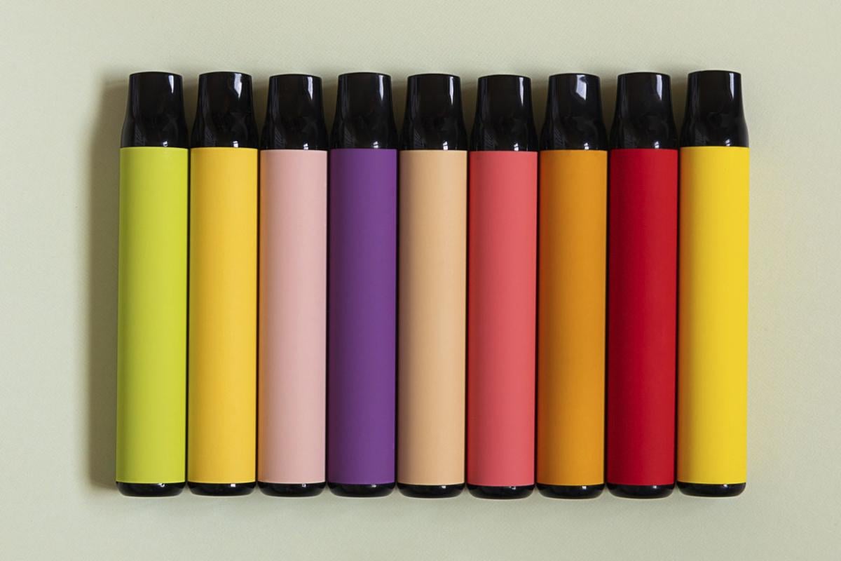 A row of e-cigarettes in different colors