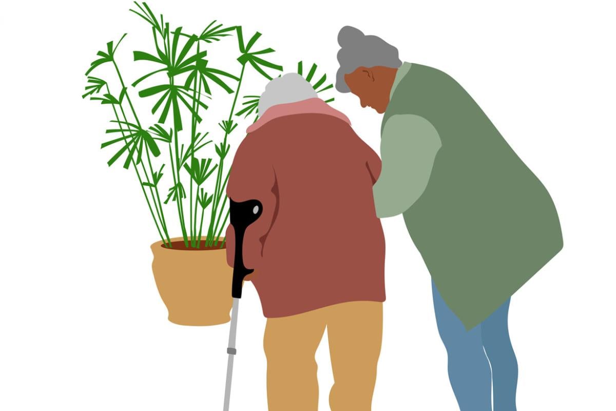 Two senior women, one is helping the other to walk with a cane