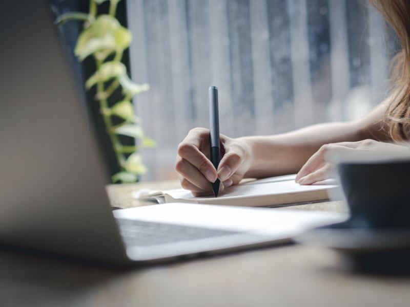 Person studies in front of a laptop