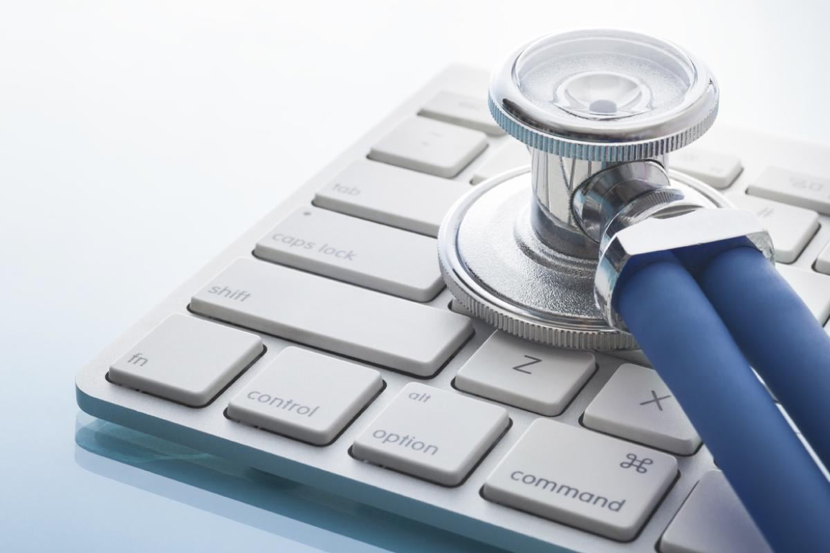 Why We Fight Tech pillar: Stethoscope on top of keyboard